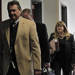 Assistant district attorney Karen Pearson, right, and members of the prosecution team  arrive for a hearing for Aurora theater shooting suspect James Holmes at the courthouse in Centennial, Colo., on Wednesday, April 10, 2013. 