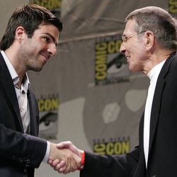 Actor Zachary Quinto, left, and actor Leonard Nimoy, right, shake hands during a panel discussion at Comic Con in San Diego, Calif. on Thursday, July 26, 2007. Quinto has been cast to play Spock in a new feature film of the classic television show "Star Trek".
