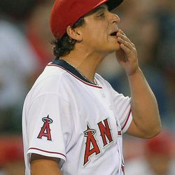 Los Angeles Angels starting pitcher Jason Vargas (60) reacts after giving up a two-run home run to Seattle Mariners second baseman Nick Franklin (20) in the third inning of a baseball game,  Monday, June 17, 2013 in Anaheim, Calif. Mariners' Endy Chavez scored on the play. 