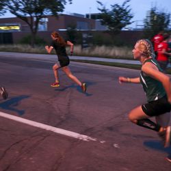 Runners make their way to the start of the Deseret News 10K race in Research Park. The race finished at Liberty Park in Salt Lake City on Tuesday, July 24, 2018.