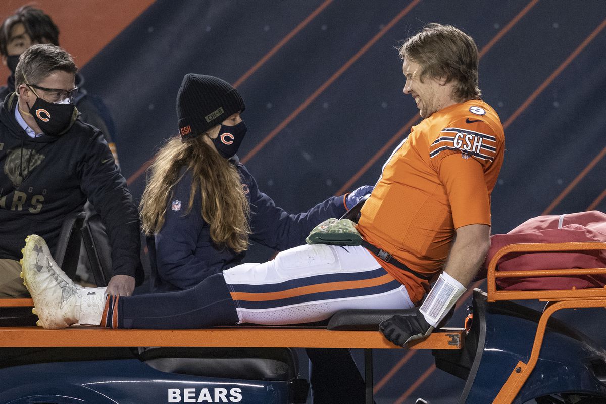 Bears quarterback Nick Foles is carted off the field after being injured near the end of Monday’s game.