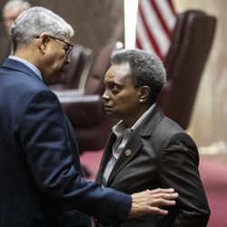 Ald. Roberto Maldonado (26th) chats with Mayor Lori Lightfoot during a contentious Chicago City Council meeting, where aldermen were scheduled to vote on attempt by the Black Caucus to delay sales of recreational marijuana in Chicago for six months to give African American and Hispanic people a chance to get a piece of the action, at City Hall, Wednesday, Dec. 18, 2019.