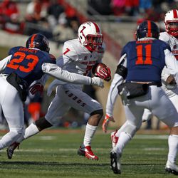 New Mexico running back Teriyon Gipson (7) carries  as UTSA safety Darryl Godfrey and safety Nate Gaines defend during the first half of the New Mexico Bowl NCAA college football game in Albuquerque, N.M., Saturday, Dec. 17, 2016. 