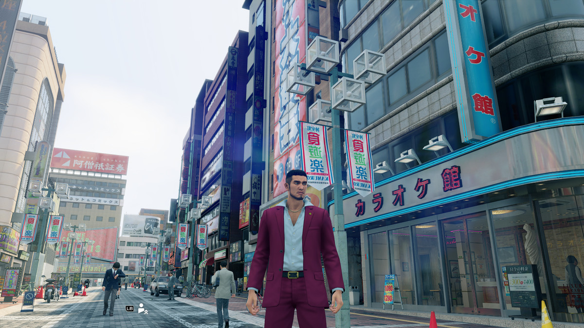 Ichiban walks down a busy city street in Yakuza: Like a Dragon