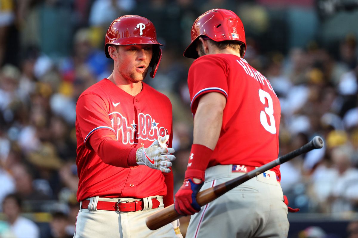 Rhys Hoskins #17 of the Philadelphia Phillies celebrates with Bryce Harper #3 after hitting a solo home run during the eighth inning against the San Diego Padres in game two of the National League Championship Series at PETCO Park on October 19, 2022 in San Diego, California.