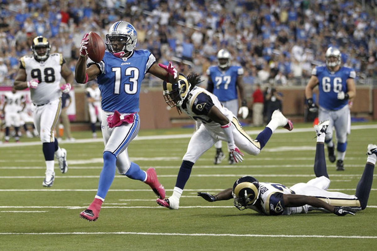 DETROIT - OCTOBER 10: Nate Burleson #13 of the Detroit Lions gets past the St. Louis Rams defense for a third quarter touchdown on October 10, 2010 at Ford Field in Detroit, Michigan. Detroit won the game 44-6. (Photo by Gregory Shamus/Getty Images)