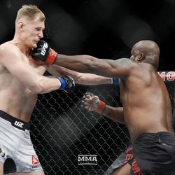 Derrick Lewis and Alexander Volkov land simultaneous left punches.