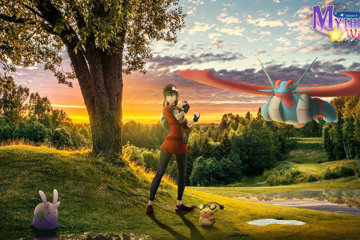 A Pokémon trainer poses next to a Mega Salamence, Dedenne, and Goomy as the sun sets