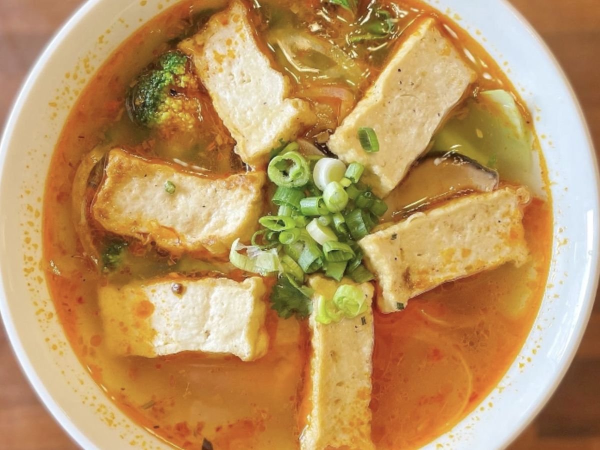 A photo of Xinh Xinh’s vegan bun bo chay noodle soup with tofu and vegetables