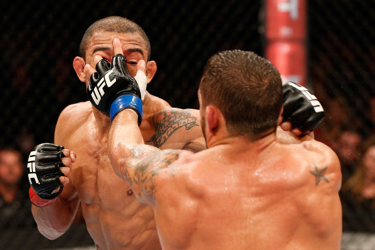 Jose Aldo being poked in the eye by Chad Mendes at UFC 179.