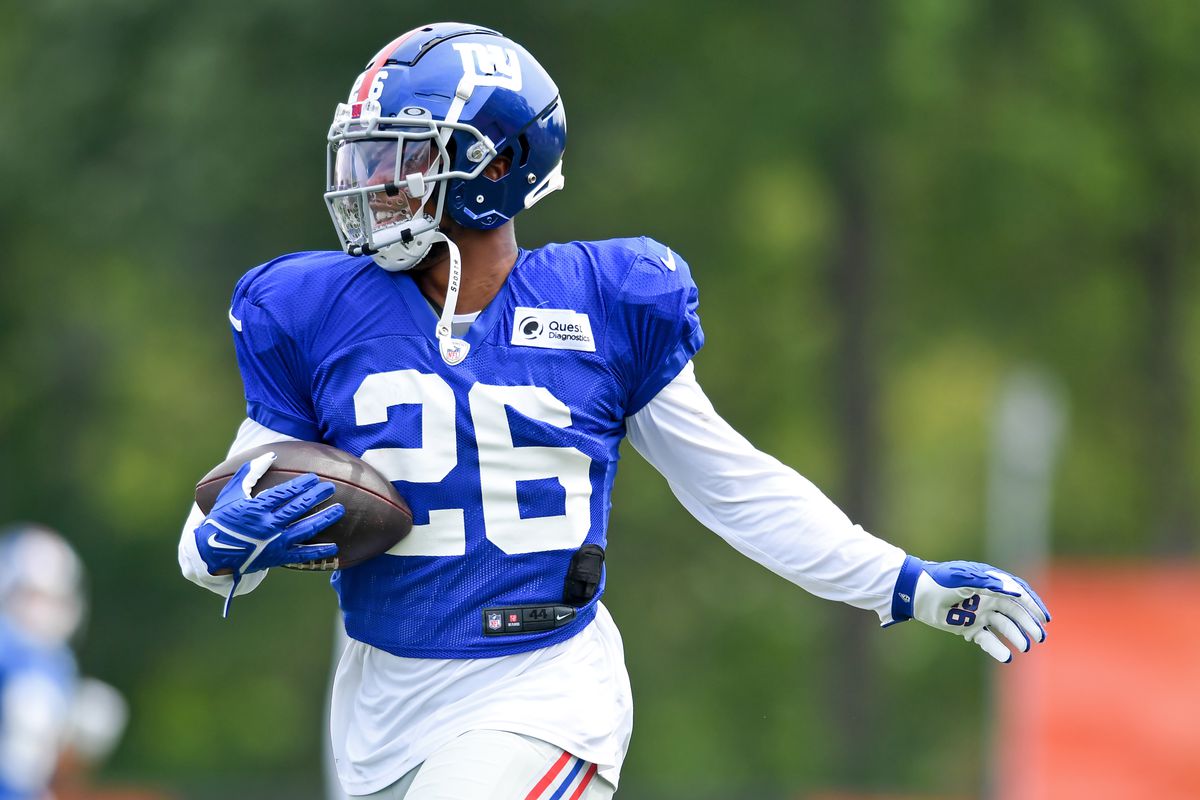 Running back Saquon Barkley #26 of the New York Giants runs a drill during a joint practice with the Cleveland Browns on August 19, 2021 in Berea, Ohio.