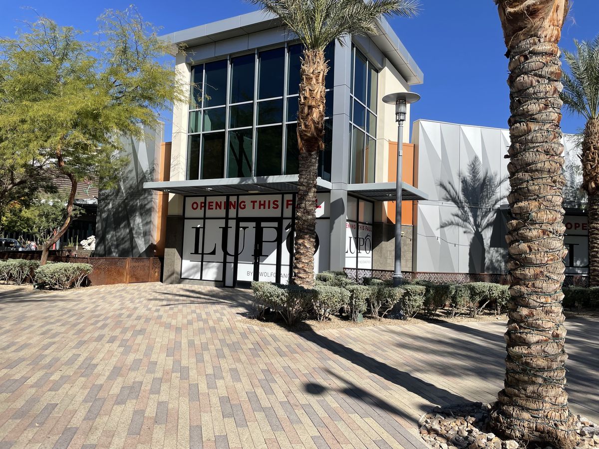 The exterior of a restaurant with signs for Lupo at Downtown Summerlin.