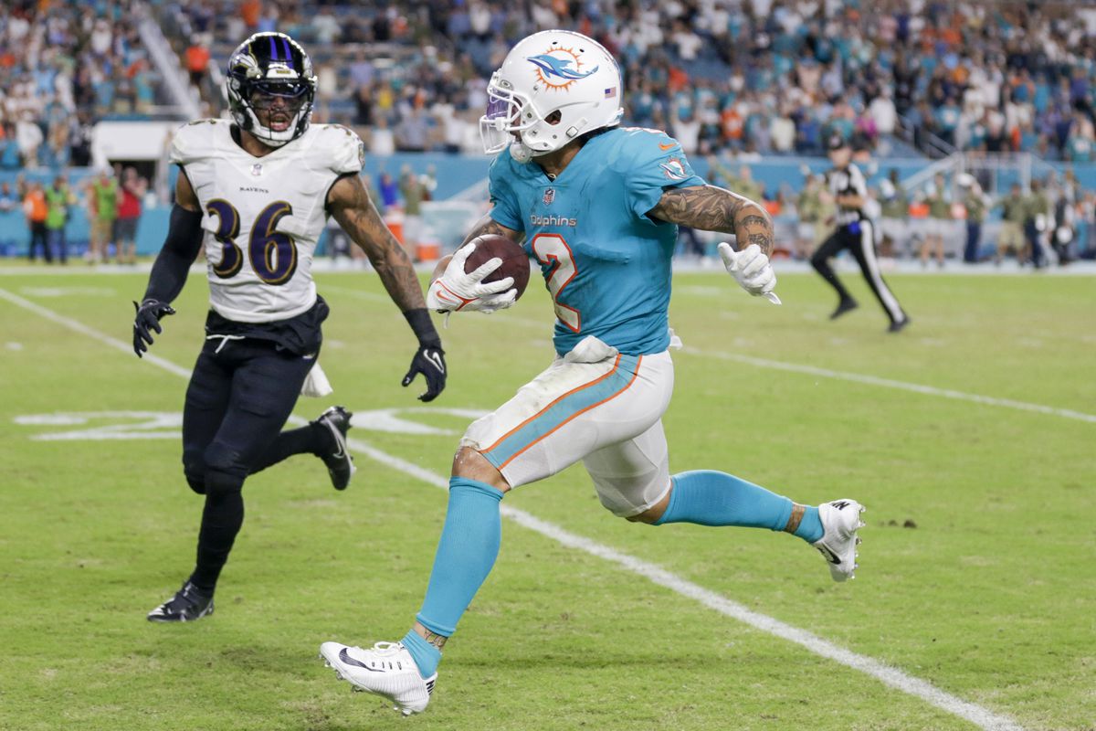 Miami Dolphins wide receiver Albert Wilson (2) runs with the football against Baltimore Ravens safety Chuck Clark (36) during the fourth quarter at Hard Rock Stadium.