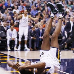 Utah Jazz guard Rodney Hood (5) hits the floor after shooting during NBA action in Salt Lake City on Friday, Nov. 4, 2016. The Spurs won 100-86.
