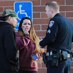 The parents of 3-year-old Bella Martinez talk to police Wednesday, Feb. 4, 2015, after the girl was kidnapped when the car she was in was stolen from a 7-Eleven store at 287 W. 3300 South in South Salt Lake. The girl was later found safe and the woman who allegedly took the car was arrested.
