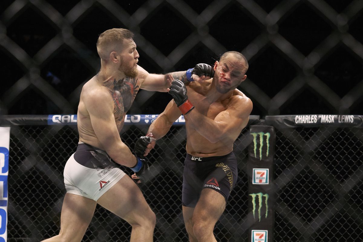 Eddie Alvarez eats a left hand from Conor McGregor during their UFC 205 title fight in 2016. 