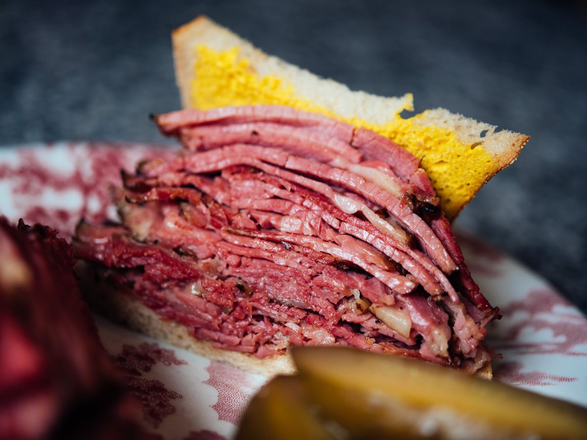 smoked meat sandwich stuffed with meat.