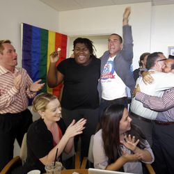 Attendees at a watch party in Miami celebrate after the U.S. Supreme Court's ruling on gay marriage in California Wednesday, June 26, 2013.  The justices issued two 5-4 rulings in their final session of the term. One decision wiped away part of a federal anti-gay marriage law that has kept legally married same-sex couples from receiving tax, health and pension benefits. The other was a technical legal ruling that said nothing at all about same-sex marriage, but left in place a trial court's declaration that California's Proposition 8 is unconstitutional. (AP Photo/Wilfredo Lee)