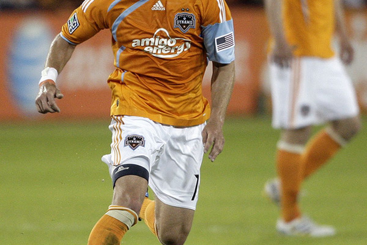 HOUSTON - APRIL 01: Brad Davis #11 of the Houston Dynamo looks for someone to pass to as he brings the ball up the field against Real Salt Lake on April 1, 2010 in Houston, Texas.  (Photo by Bob Levey/Getty Images)