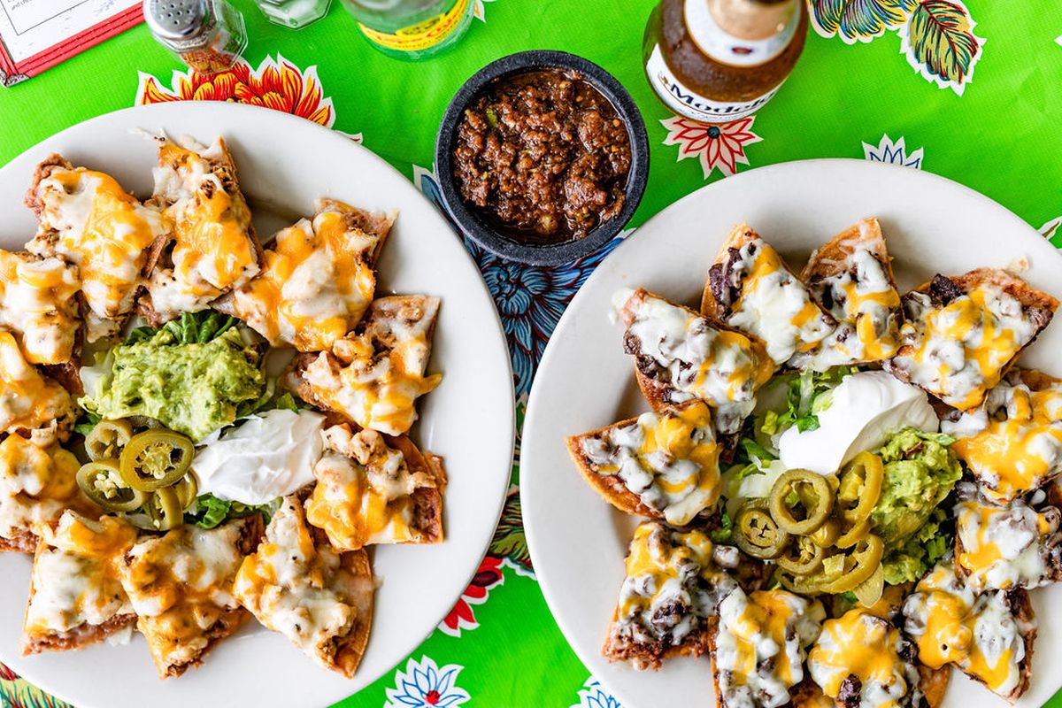 Mandito’s steak and chicken nachos topped with cheese, sour cream, guacomole, and jalapenos.