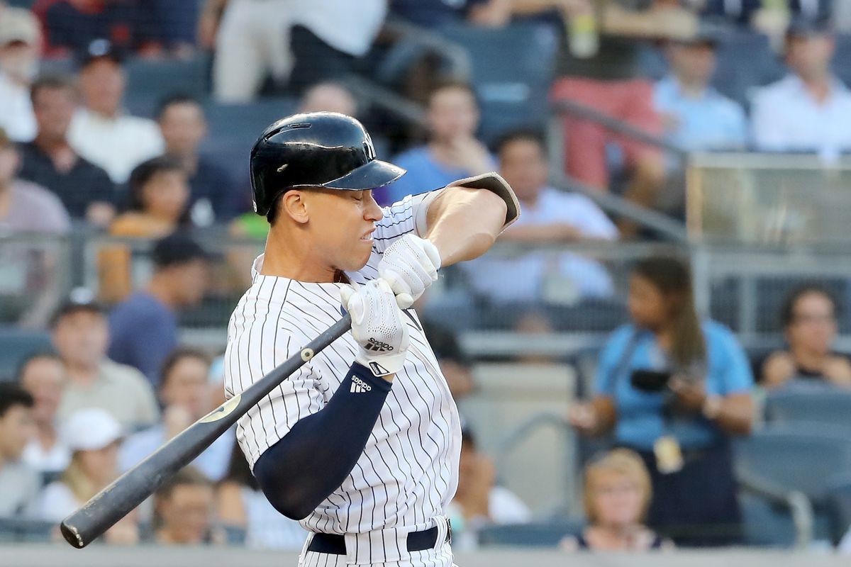 Aaron Judge of the New York Yankees is hit by a pitch in the first inning against the Kansas City Royals at Yankee Stadium on July 26, 2018.