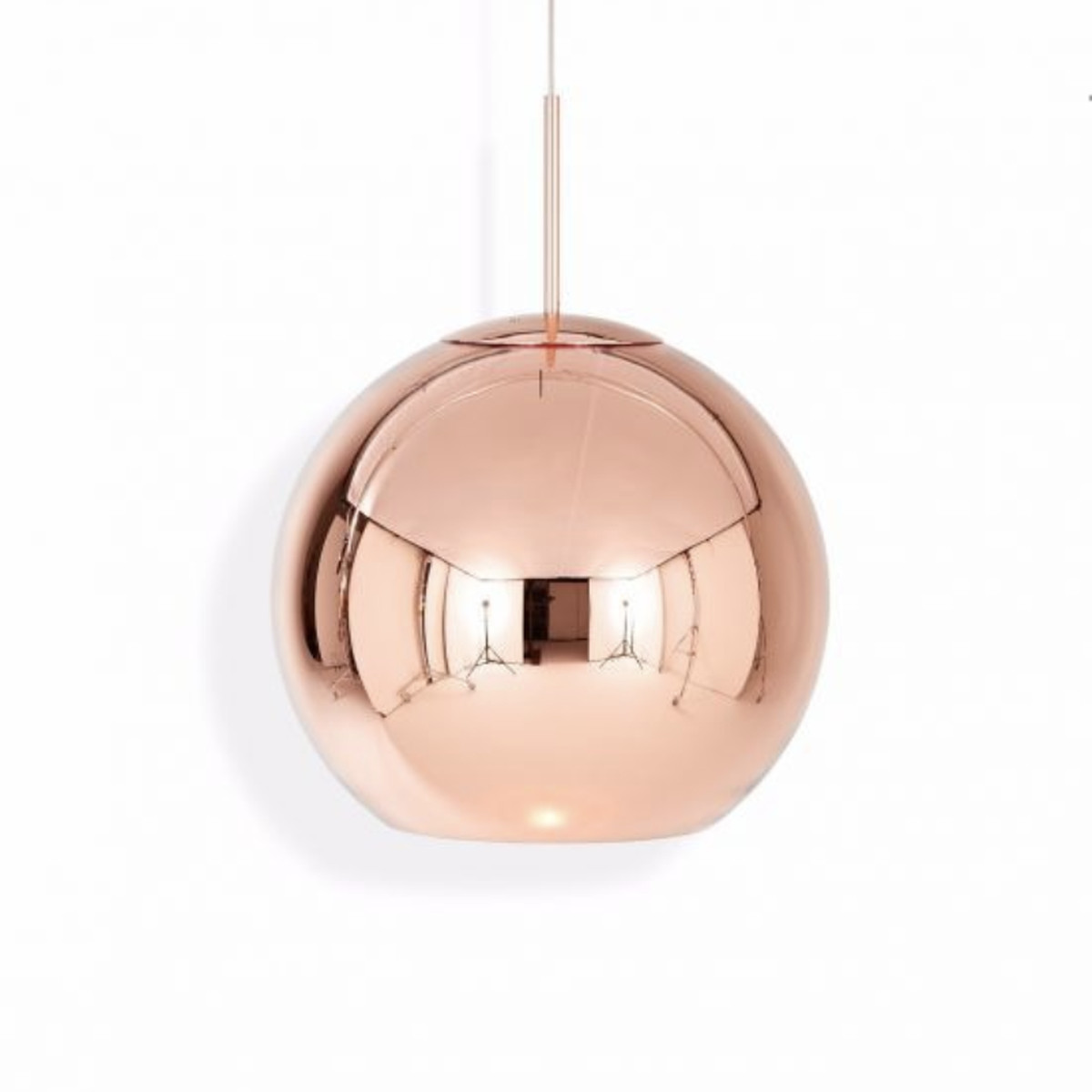 A round copper-colored light pendant that hangs from the ceiling. 