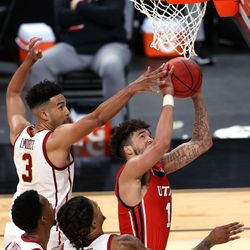 USC Trojans forward Isaiah Mobley (3) tries to stop Utah Utes forward Timmy Allen (1) from putting up a shot as Utah and USC play in the Pac-12 Tournament at T-Mobile Arena in Las Vegas on Thursday, March 11, 2021. USC won 91-85 in double overtime.
