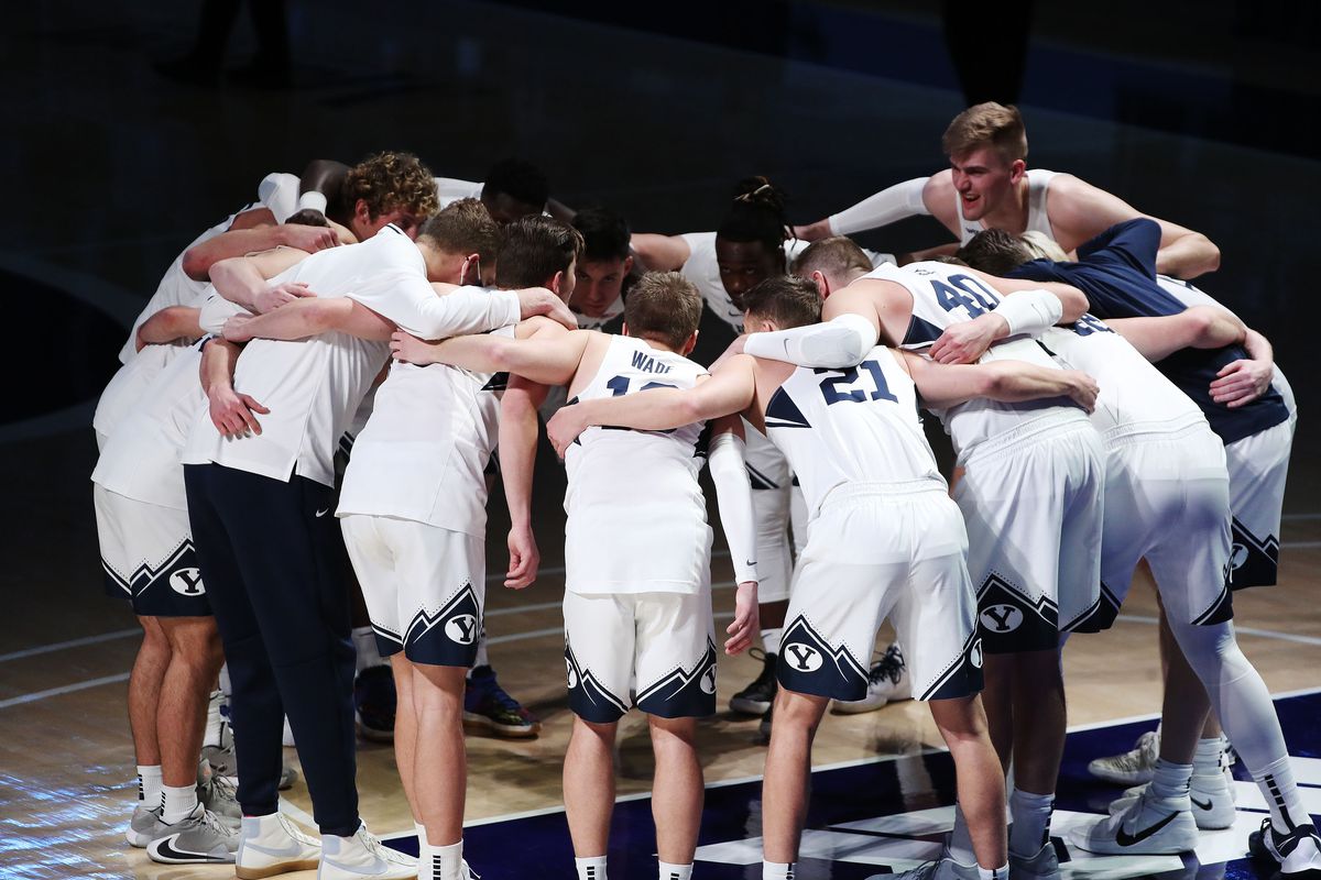 The Brigham Young Cougars huddle at the start of the game in Provo on Thursday, Feb. 25, 2021.