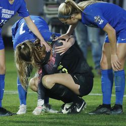 BYU players console Brigham Young Cougars goalkeeper Cassidy Smith after the overtime loss during the NCAA national soccer championship at Stevens Stadium at Santa Clara University in Santa Clara, Calif. on Monday, Dec. 6, 2021. BYU lost in overtime penalty kicks.