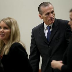 Martin MacNeill stands with his defense team during a brief break in proceedings in Provo's 4th District Court on Wednesday, Oct. 30, 2013. MacNeill is charged with murder in the 2007 death of his wife, Michele MacNeill.