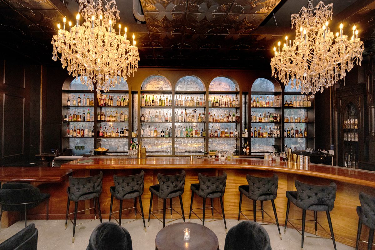 An ornate bar with chandeliers. 