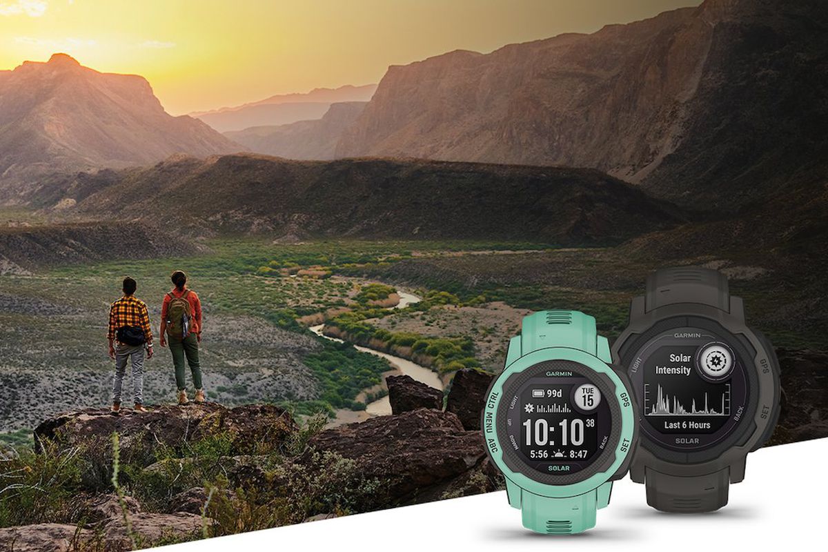 A shot of two people hiking with the Garmin Instinct 2S and the regular Instinct 2.
