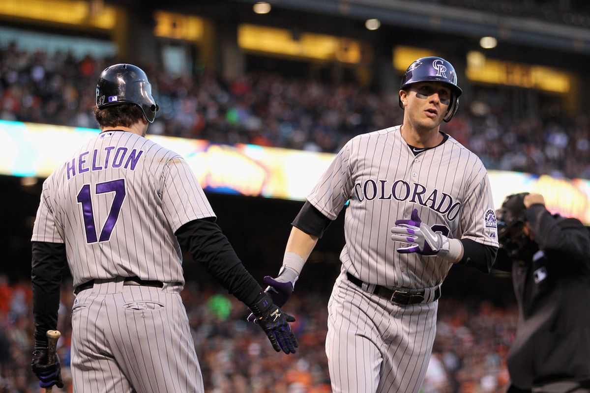 SOMEWHERE IN CA - MAY 06:  Troy Tulowitzki #2 is congratulated by Todd Helton #17 of the Colorado Rockies after he hit a home run against a baseball team at a baseball park on May 6, 2011 somewhere in California.  (Photo by Ezra Shaw/Getty Images)