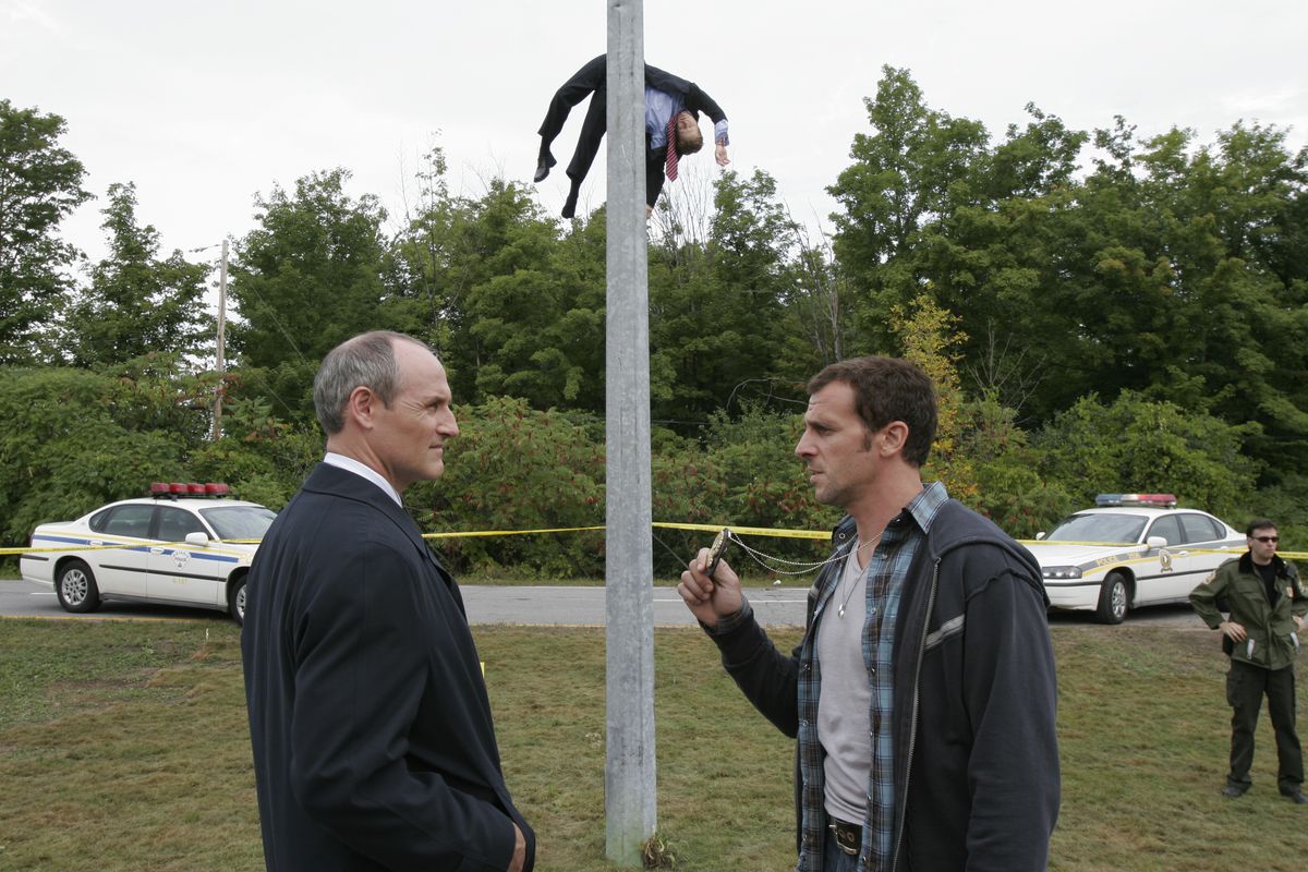 Colm Feore and Patrick Huard (and an unfortunate victim) in Bon Cop, Bad Cop.﻿