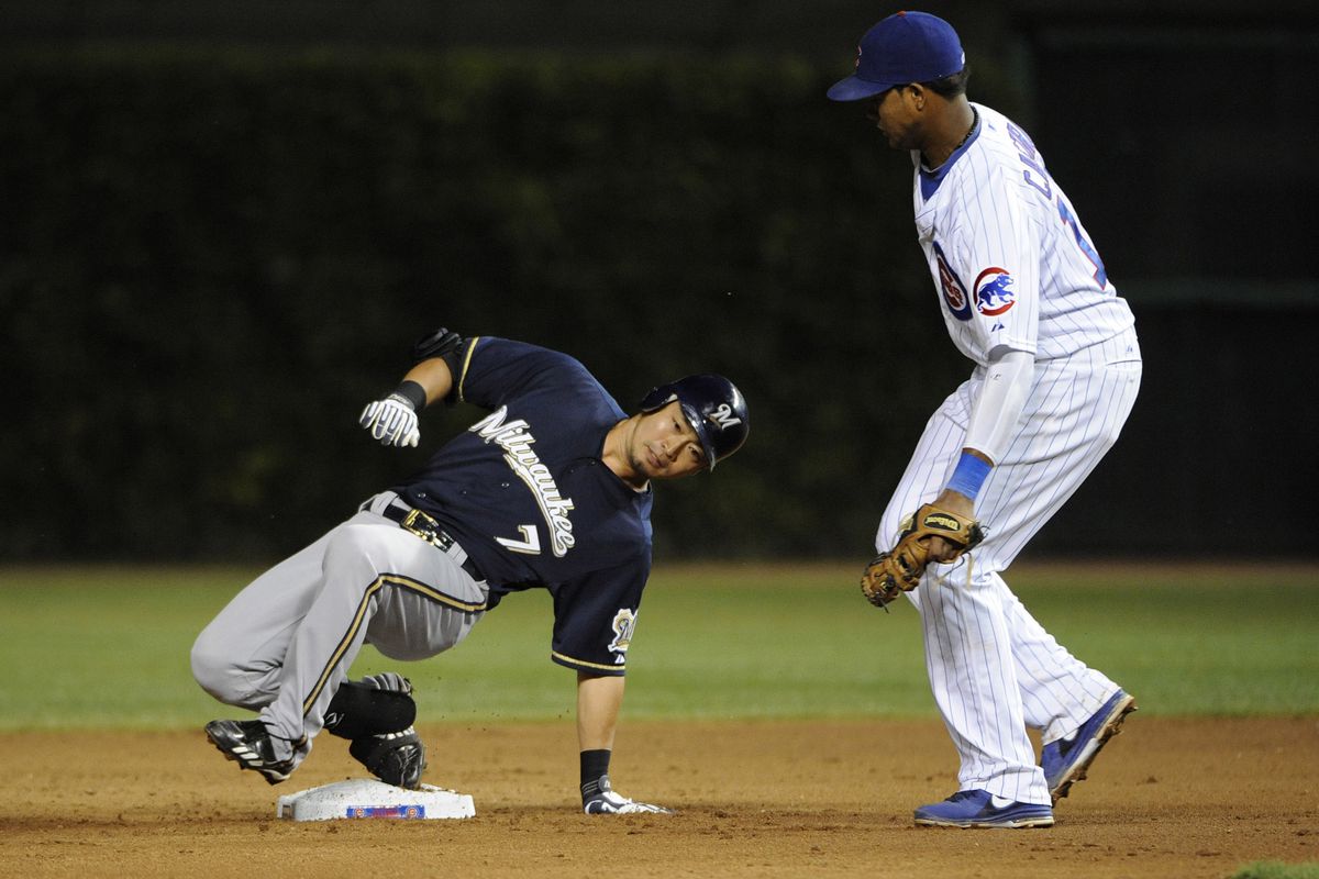 Chicago, IL, USA; Milwaukee Brewers right fielder Norichika Aoki slides safely into second base with a double as Chicago Cubs shortstop Starlin Castro can't make a tag at Wrigley Field. Credit: David Banks-US PRESSWIRE