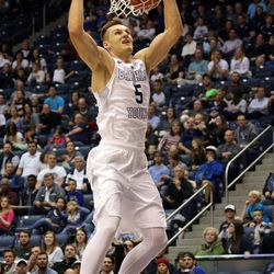 Brigham Young Cougars guard Kyle Collinsworth (5) dunks the ball during a men's basketball game against the Central Michigan Chippewas at the Marriott Center in Provo on Friday, Dec. 18, 2015. 