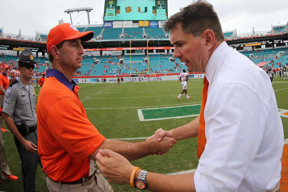MIAMI GARDENS, FL - OCTOBER 24:  Head coach Al Golden of the Miami Hurricanes  and head coach Dabo Swinney of the Clemson Tigers  shake hands after a game  at Sun Life Stadium on October 24, 2015 in Miami Gardens, Florida.  (Photo by Mike Ehrmann/Getty Images)