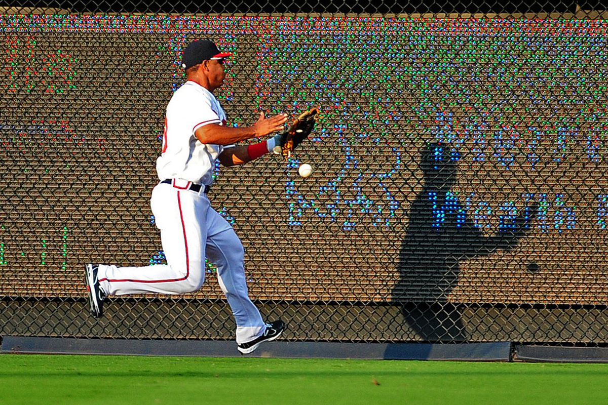 ATLANTA - JULY 27: Wilkin Ramirez #30 of the Atlanta Braves is unable to catch a fly ball against the Pittsburgh Pirates at Turner Field on July 27, 2011 in Atlanta, Georgia. (Photo by Scott Cunningham/Getty Images)