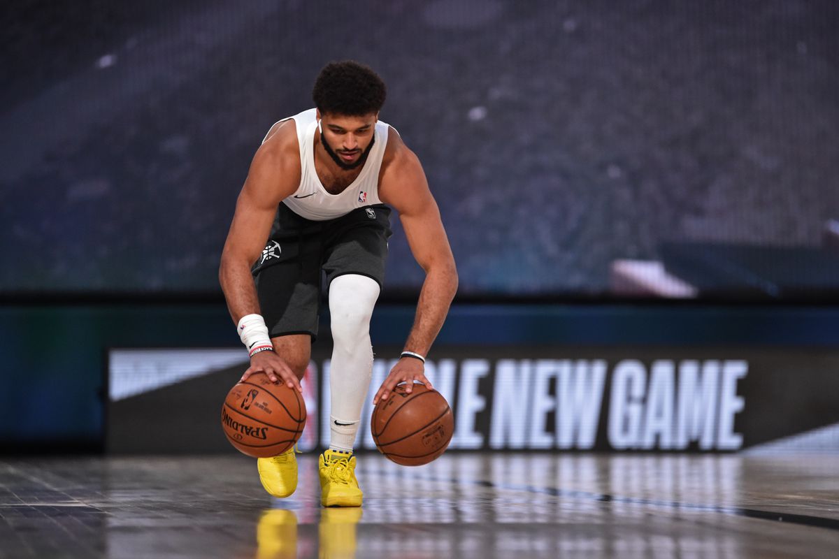 Jamal Murray of the Denver Nuggets warms up before the game against the San Antonio Spurs on August 5, 2020 in Orlando, Florida at Visa Athletic Center at ESPN Wide World of Sports.