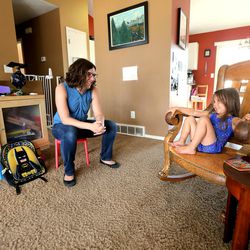 Kat Martinez talks with her daughter Jenny at home on Wednesday, Aug. 23, 2017. She fears a high-risk insurance pool would raise costs for the family.