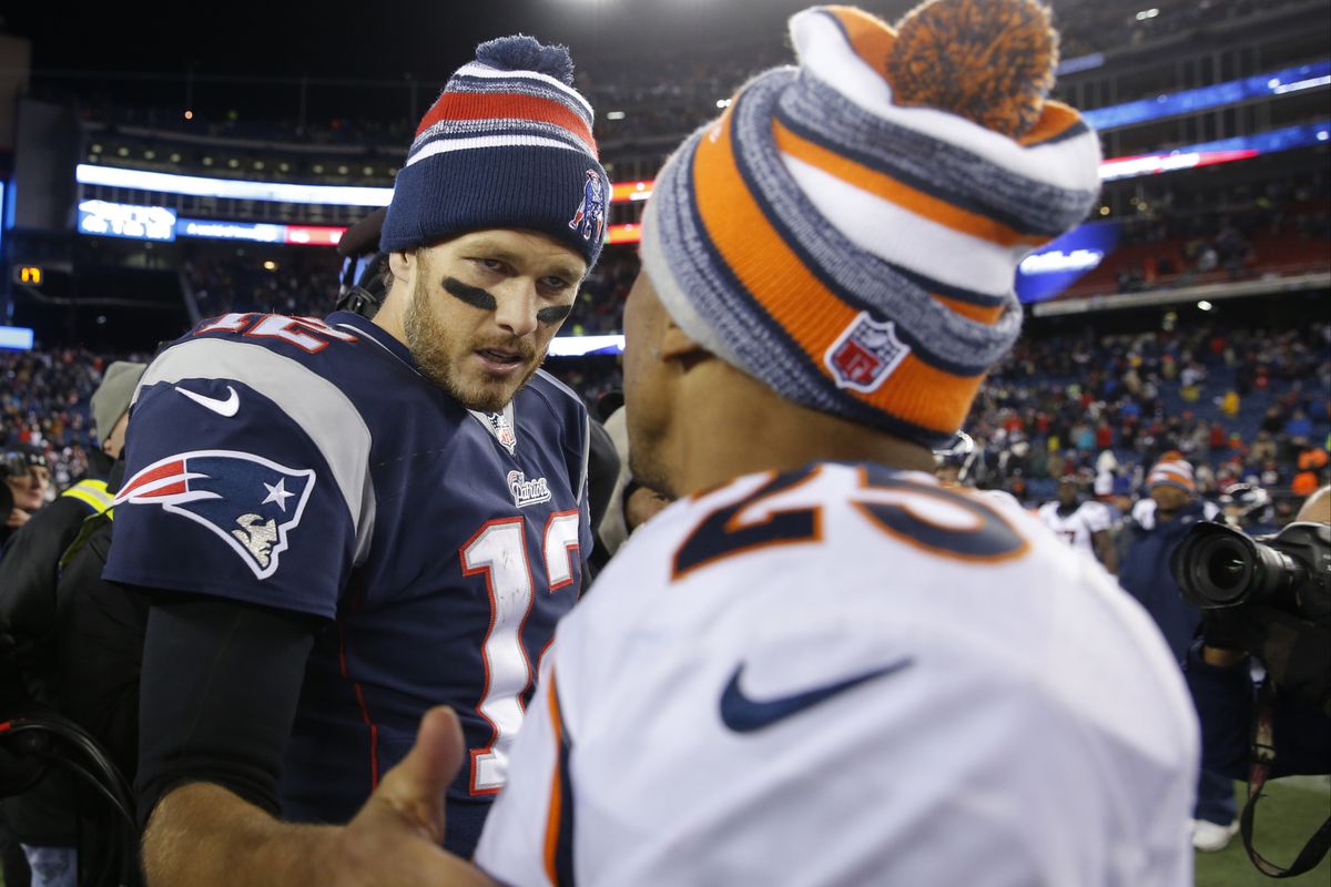 Tom Brady shakes hands with Chris Harris Jr. on the field after the game. 