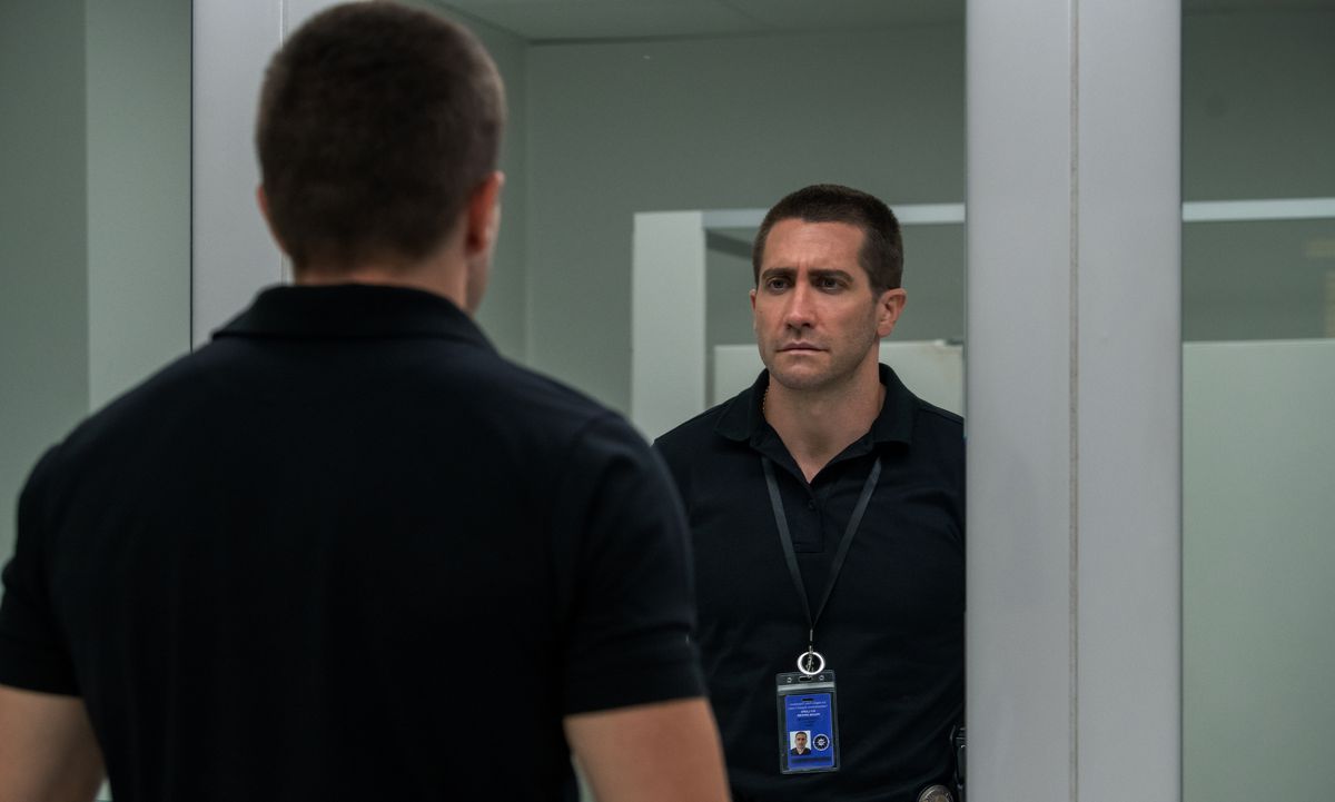 Jake Gyllenhaal looks nervous when staring in the mirror in Netflix's The Guilty, as if he might be the Sinner himself