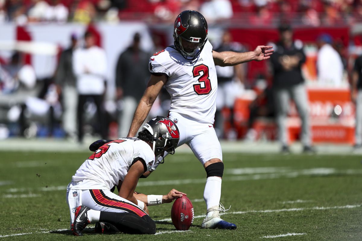 Ryan Succop #3 of the Tampa Bay Buccaneers kicks a field goal as Jake Camarda #5 holds during the second quarter of the game against the Atlanta Falcons at Raymond James Stadium on October 9, 2022 in Tampa, Florida.