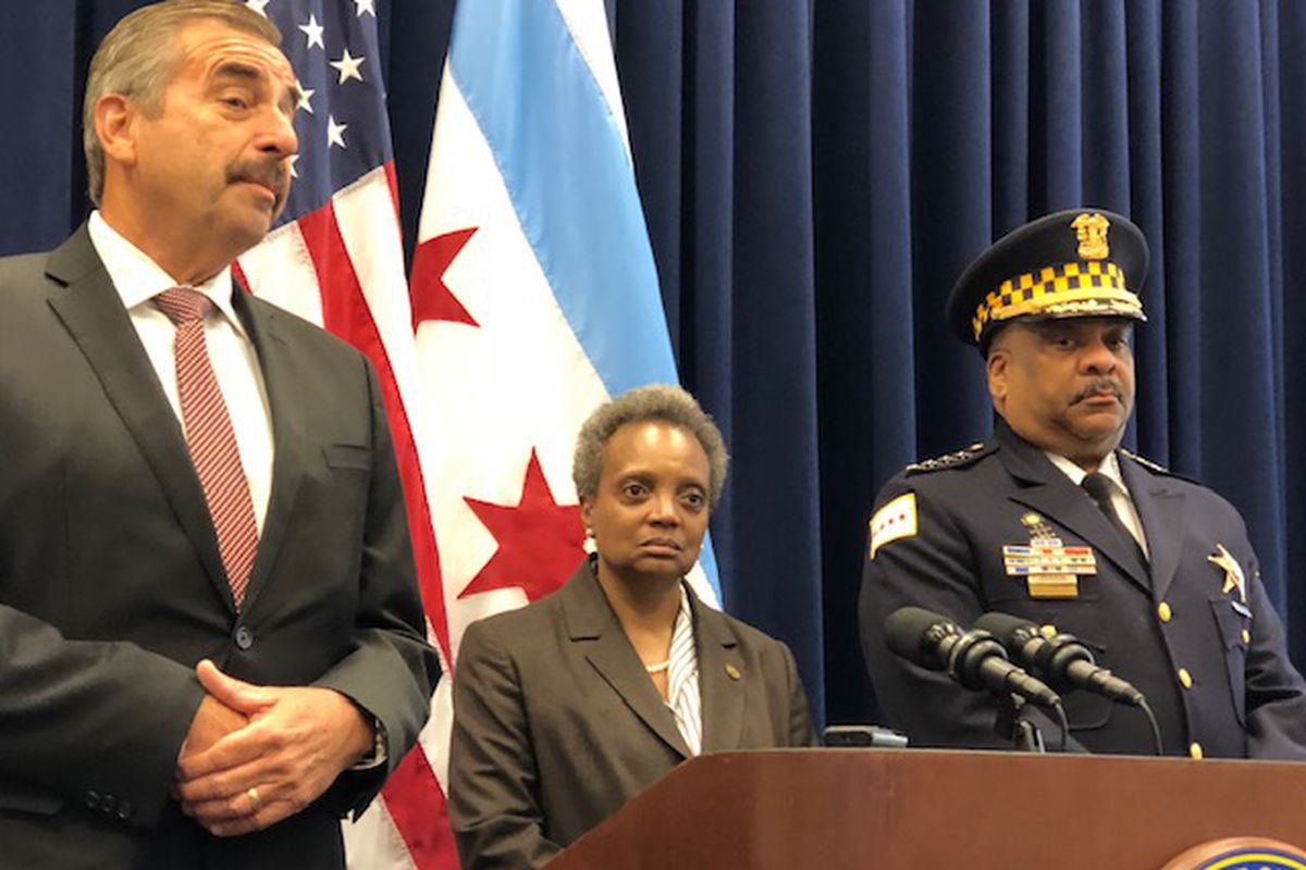 Soon-to-be interim Police Supt. Charlie Beck, left, Mayor Lori Lightfoot and retiring Police Supt. Eddie Johnson answer questions from reporters at City Hall after a police and fire awards ceremony on Friday.