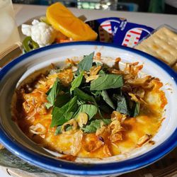PST's Cua Dip is made with crab, shrimp, melted cheese, fried shallots and basil, served with crackers.