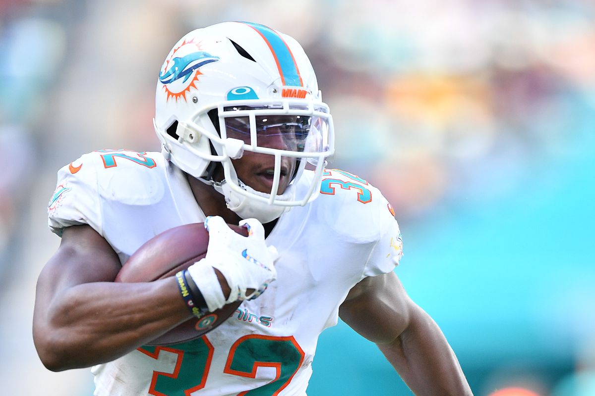 Kenyan Drake of the Miami Dolphins runs with the ball against Washington in the fourth quarter at Hard Rock Stadium on October 13, 2019 in Miami, Florida.