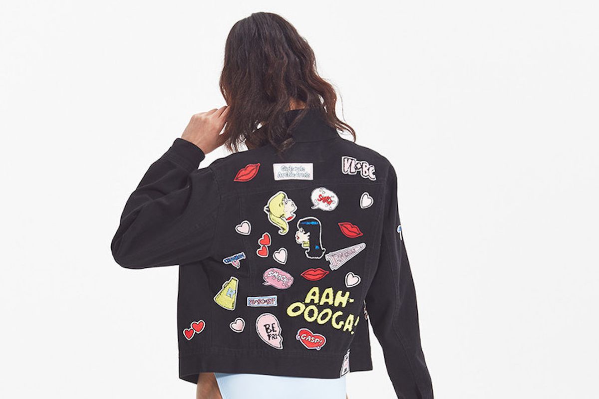 A model wearing a Rachel Antonoff black denim jacket with patches from Archie Comics