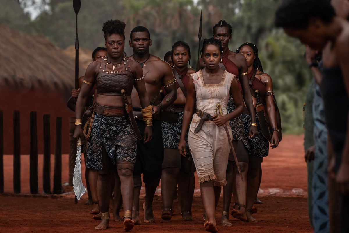 Nanisca (Viola Davis) and Nawi (Thuso Mbedu) return with a group of warriors from battle