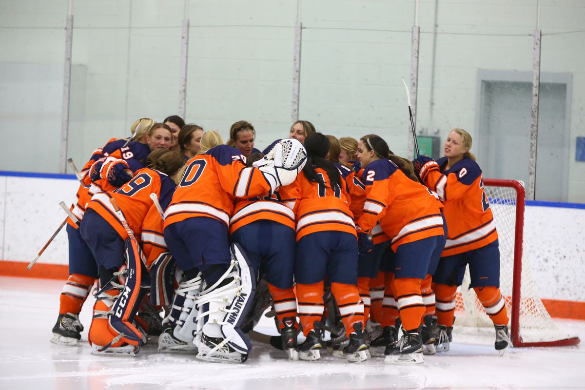 Syracuse women's ice hockey team huddling before a game.