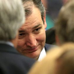 Republican presidential candidate, Sen. Ted Cruz, R-Texas, listens to a supporters at a caucus site,  Saturday, March 5, 2016, in Wichita, Kan.